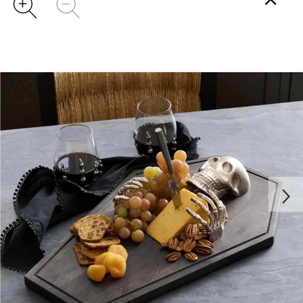 Skeleton on Dark Brown Coffin charcuterie board by Pottery Barn
